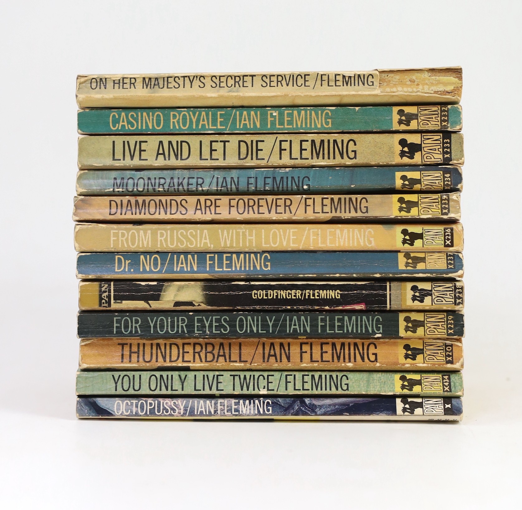 Fleming, Ian - 12 paperbacks, published by Pan Books, consisting - Casino Royale, 1964; Live and Let Die, 1965; Moonraker, 1964; Diamonds Are Forever, 1965; From Russia with Love, 1965; Dr. No, 1964; Goldfinger, 1964; Fo